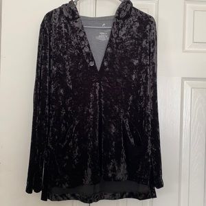 A black, velvet, long sleeve shirt, with a hood